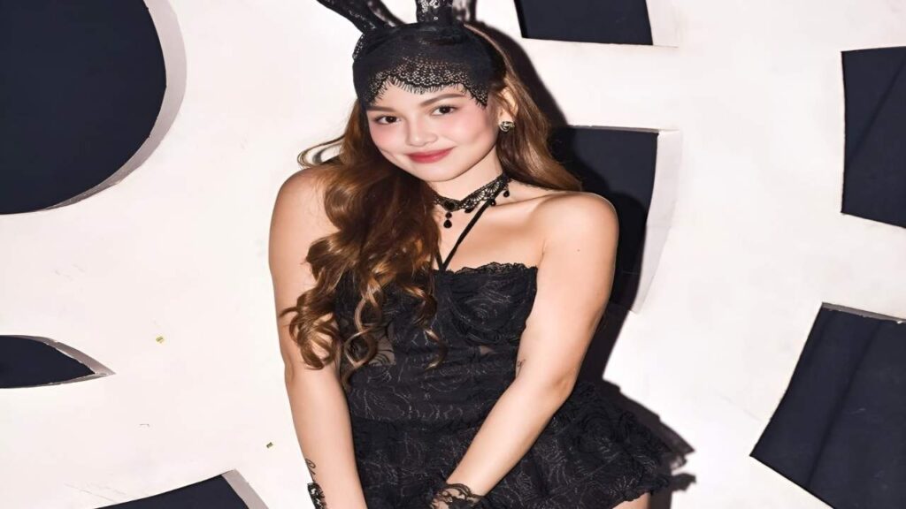 Angelica Heart poses for a photo in a black bunny costume, showcasing playful and festive attire.