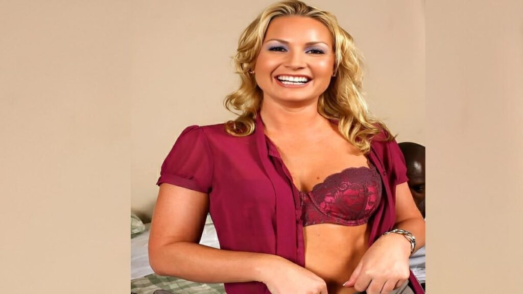 Flower Tucci wearing a red bra and panties, exuding confidence and joy.