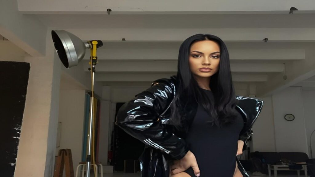 Kasia Lenhardt poses confidently in a stylish black leather outfit for a photo