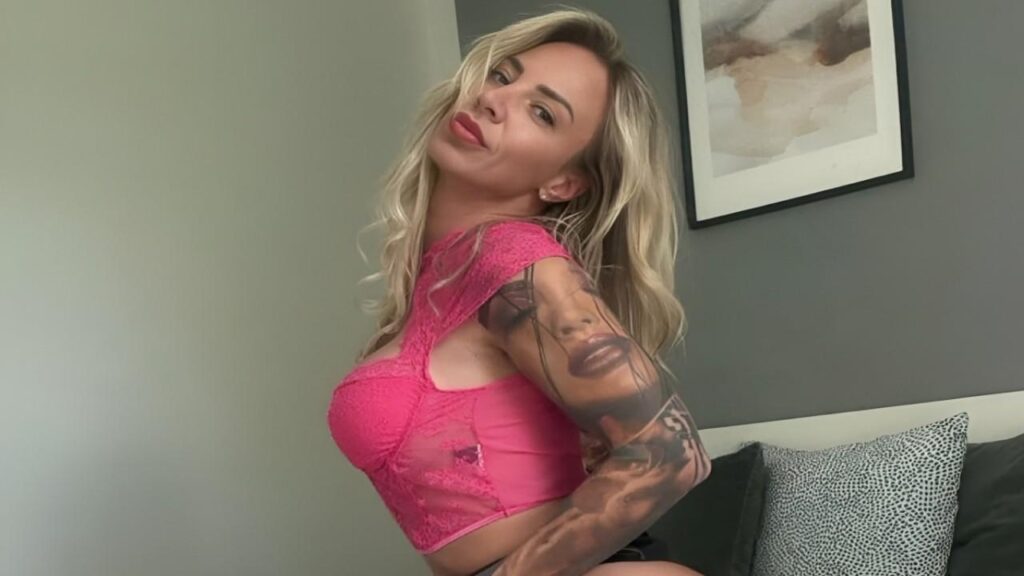 Nathaly Cherie with intricate tattoos adorning her arms and legs, showcasing her unique style and personal expression