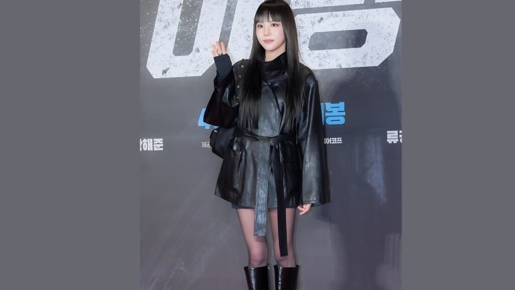 Lee Yeon-doo (이연두) wearing a black leather jacket and boots stands confidently, showcasing a stylish and edgy fashion choice