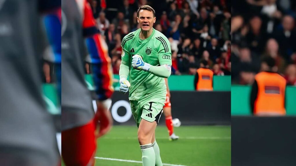 Manuel Neuer in bright green kit and white gloves charges forward on the pitch, crowd blurred behind.