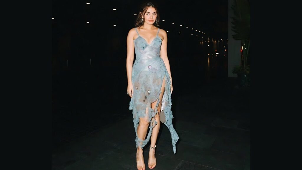 Janine Gutierrez in a blue dress poses confidently for the camera, smiling and showcasing her outfit.