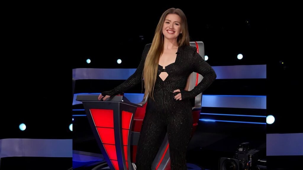Kelly Clarkson appears on stage at The Voice Australia, engaging with contestants and the audience.